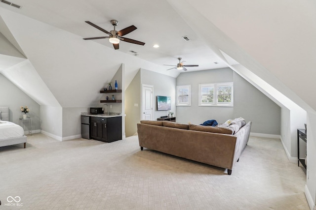 1616 N Delaware St, Indianapolis, IN 46202 - living room with light carpet, a ceiling fan, lofted ceiling, baseboards, and recessed lighting