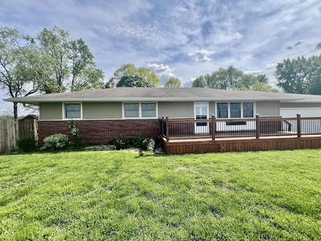 view of front of property featuring brick siding and a deck