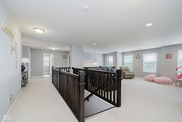 1274 Timber Bluff Rd, Westfield, IN 46074 - hallway featuring light carpet, an upstairs landing, baseboards, and recessed lighting