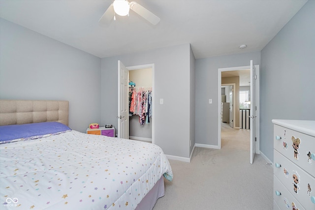 1274 Timber Bluff Rd, Westfield, IN 46074 - bedroom with light carpet, baseboards, ceiling fan, and a walk in closet
