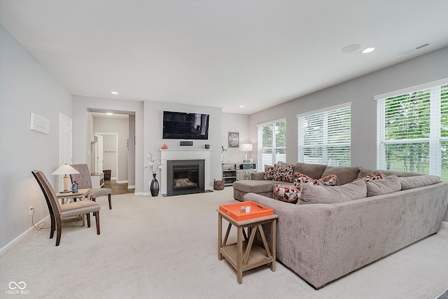 1274 Timber Bluff Rd, Westfield, IN 46074 - living area with light carpet, a fireplace with flush hearth, baseboards, and recessed lighting