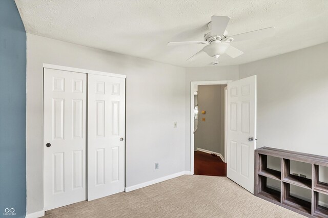 5041 Millwright Ct, Indianapolis, IN 46254 - unfurnished bedroom featuring a closet, carpet floors, ceiling fan, and baseboards