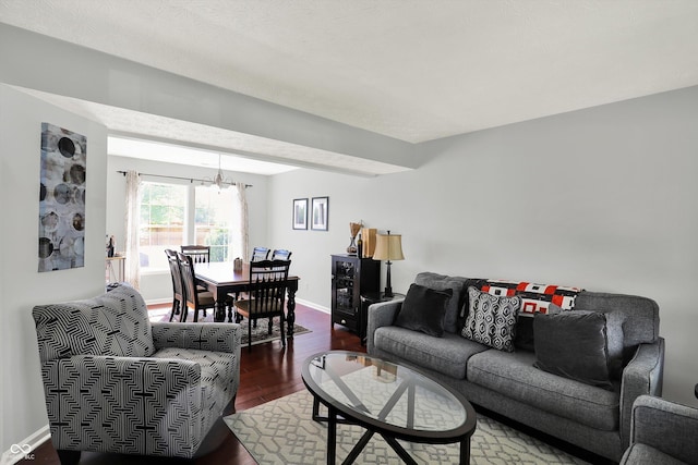 5041 Millwright Ct, Indianapolis, IN 46254 - living room with a chandelier, dark wood finished floors, and baseboards