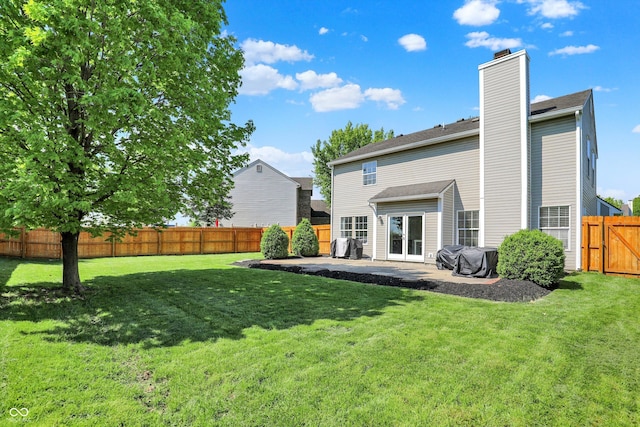 5041 Millwright Ct, Indianapolis, IN 46254 - rear view of property with a chimney, a patio, and french doors