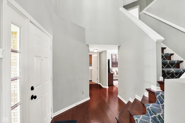 5041 Millwright Ct, Indianapolis, IN 46254 - entryway with stairway, hardwood / wood-style floors, a towering ceiling, and baseboards