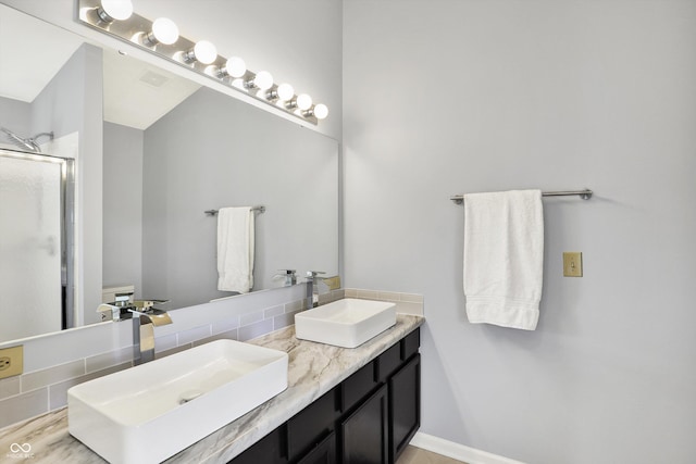 5041 Millwright Ct, Indianapolis, IN 46254 - full bathroom featuring a shower stall, double vanity, and tasteful backsplash