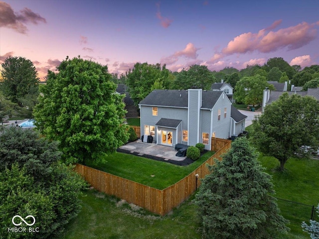 5041 Millwright Ct, Indianapolis, IN 46254 - back of house with a patio area and a chimney