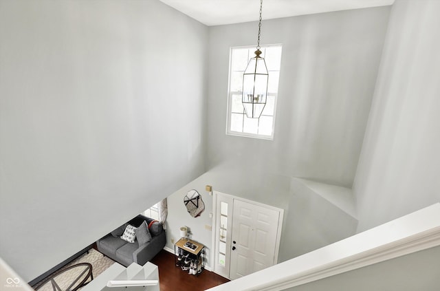 5041 Millwright Ct, Indianapolis, IN 46254 - stairs with wood finished floors, a high ceiling, and baseboards