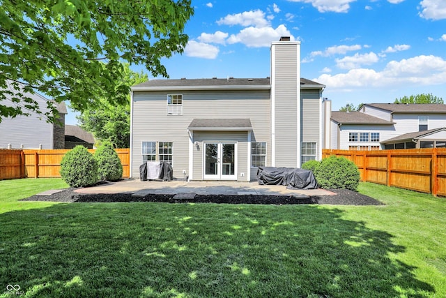 5041 Millwright Ct, Indianapolis, IN 46254 - rear view of house with french doors, a patio, and a chimney