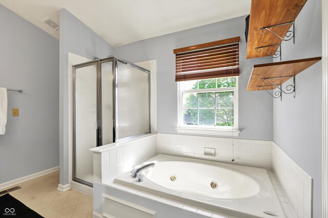 5041 Millwright Ct, Indianapolis, IN 46254 - bathroom featuring a stall shower and a tub with jets