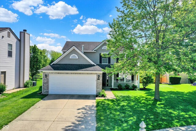 5041 Millwright Ct, Indianapolis, IN 46254 - traditional-style home featuring driveway, brick siding, a front yard, an attached garage, and a shingled roof