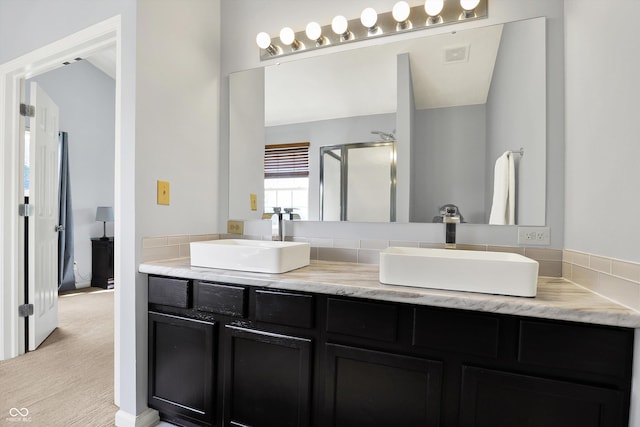5041 Millwright Ct, Indianapolis, IN 46254 - bathroom with a shower stall and double vanity