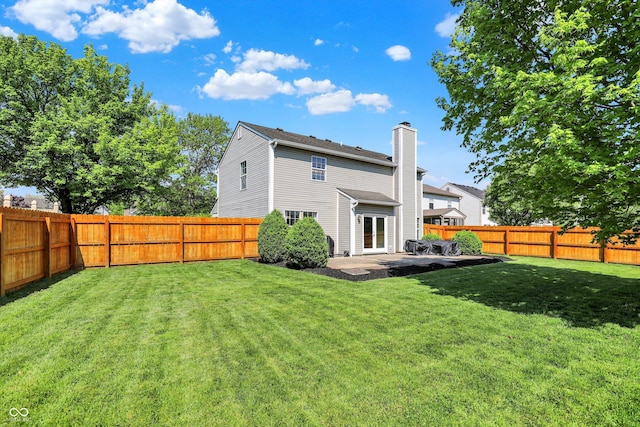 5041 Millwright Ct, Indianapolis, IN 46254 - back of property featuring a chimney and a patio