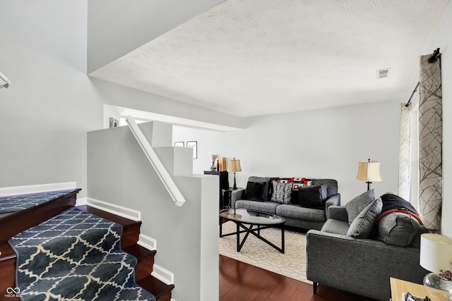5041 Millwright Ct, Indianapolis, IN 46254 - stairs with wood finished floors, a textured ceiling, and baseboards
