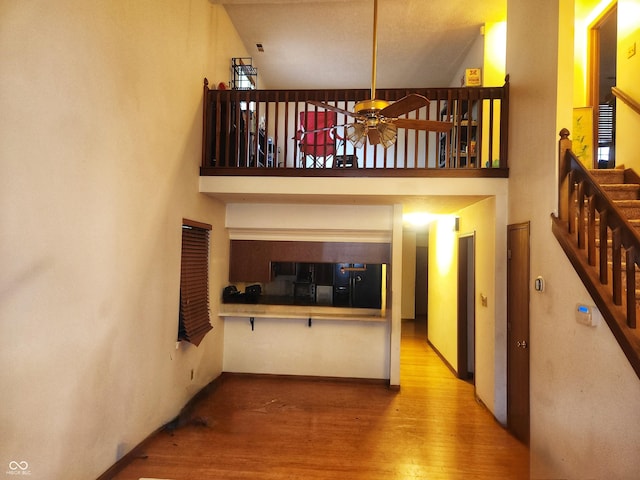 4336 Abby Creek Ln, Indianapolis, IN 46205 - hall with a high ceiling, wood finished floors, and stairway