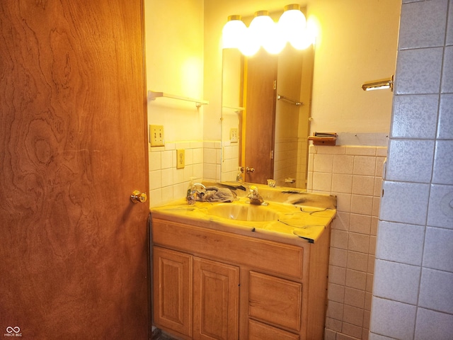 4336 Abby Creek Ln, Indianapolis, IN 46205 - bathroom with tile walls, a wainscoted wall, and vanity