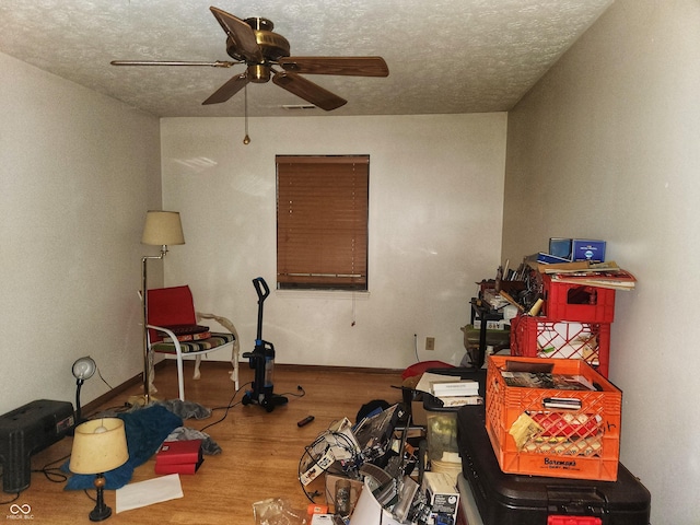 4336 Abby Creek Ln, Indianapolis, IN 46205 - interior space featuring a ceiling fan, wood finished floors, a textured ceiling, and baseboards