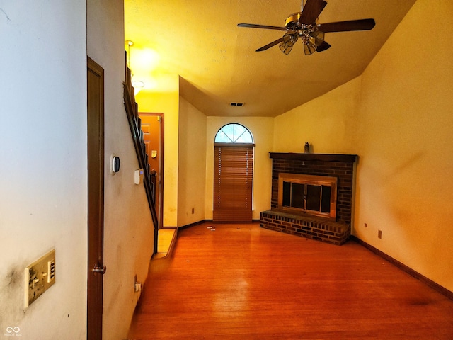 4336 Abby Creek Ln, Indianapolis, IN 46205 - unfurnished living room featuring wood finished floors, a ceiling fan, a brick fireplace, and baseboards