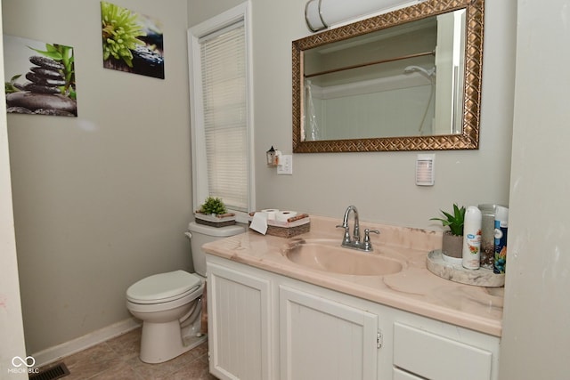 122 E 27th St, Indianapolis, IN 46205 - bathroom featuring vanity, toilet, and baseboards