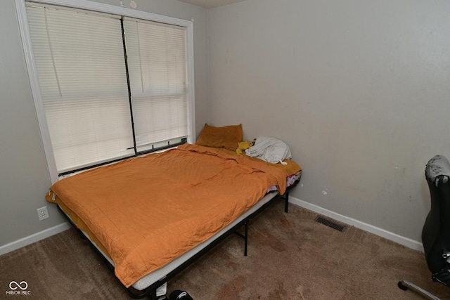 122 E 27th St, Indianapolis, IN 46205 - bedroom featuring carpet and baseboards