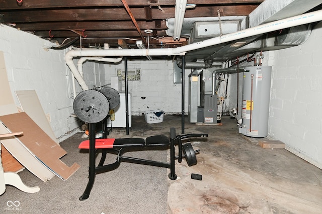 122 E 27th St, Indianapolis, IN 46205 - exercise room featuring water heater, heating unit, and concrete block wall
