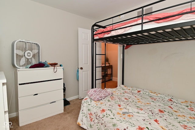 122 E 27th St, Indianapolis, IN 46205 - bedroom with light colored carpet and baseboards