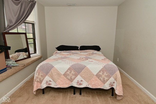 122 E 27th St, Indianapolis, IN 46205 - carpeted bedroom with baseboards