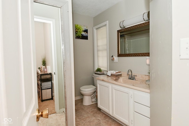 122 E 27th St, Indianapolis, IN 46205 - bathroom with vanity, toilet, tile patterned floors, and curtained shower