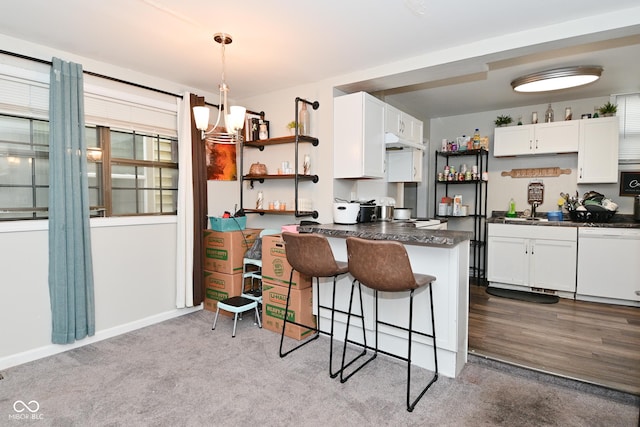 122 E 27th St, Indianapolis, IN 46205 - kitchen with dishwasher, open shelves, dark countertops, and white cabinetry