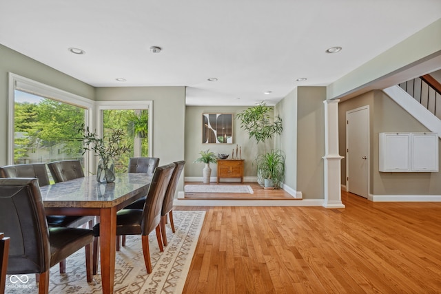 8330 Claridge Rd, Indianapolis, IN 46260 - dining space with baseboards, light wood-type flooring, stairway, and recessed lighting
