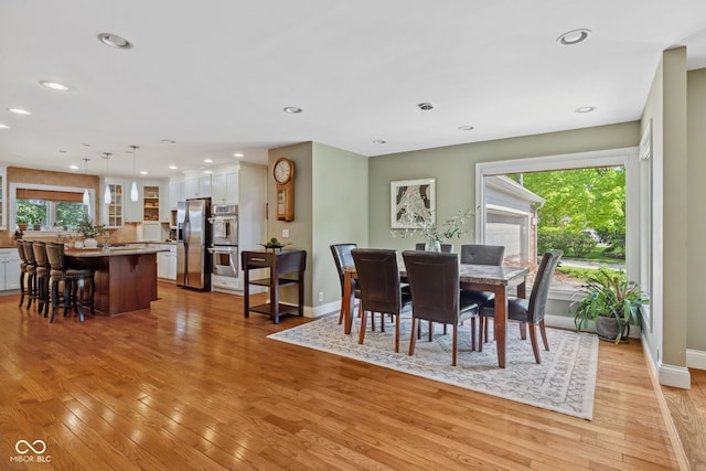 8330 Claridge Rd, Indianapolis, IN 46260 - dining room with healthy amount of natural light, light wood-type flooring, baseboards, and recessed lighting