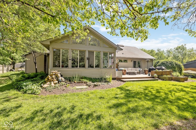8330 Claridge Rd, Indianapolis, IN 46260 - rear view of house with an outdoor living space, a lawn, and a sunroom