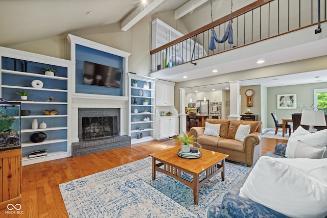 8330 Claridge Rd, Indianapolis, IN 46260 - living area featuring a brick fireplace and light wood finished floors