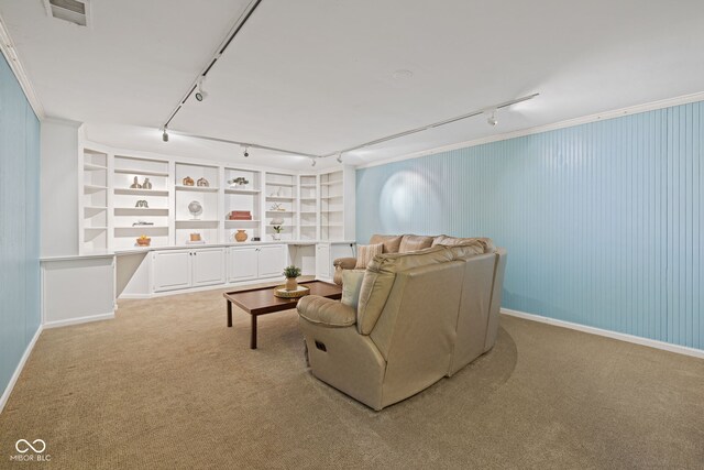 8330 Claridge Rd, Indianapolis, IN 46260 - sitting room with rail lighting, light carpet, baseboards, and built in features
