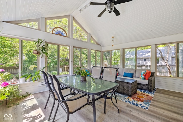 8330 Claridge Rd, Indianapolis, IN 46260 - sunroom / solarium with vaulted ceiling, ceiling fan, outdoor lounge area, and outdoor dining space