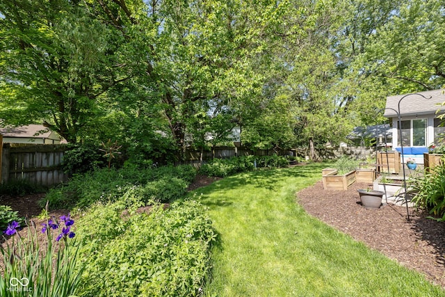 8330 Claridge Rd, Indianapolis, IN 46260 - view of yard with a garden
