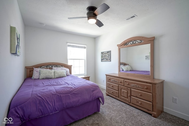 bedroom featuring carpet, ceiling fan, a textured ceiling, and baseboards
