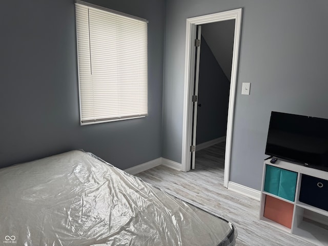 322 S Rural St, Indianapolis, IN 46201 - bedroom featuring wood finished floors and baseboards
