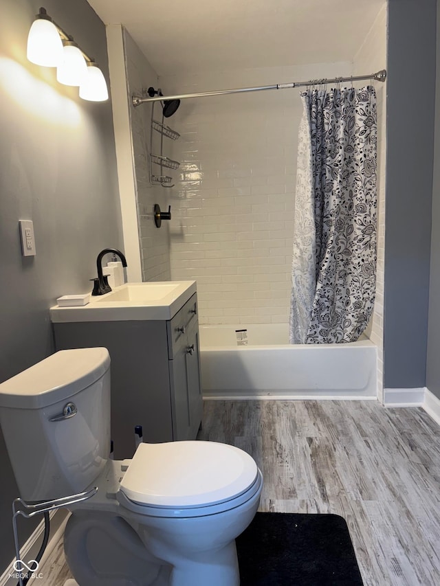 322 S Rural St, Indianapolis, IN 46201 - full bath with toilet, wood finished floors, shower / tub combo with curtain, and vanity