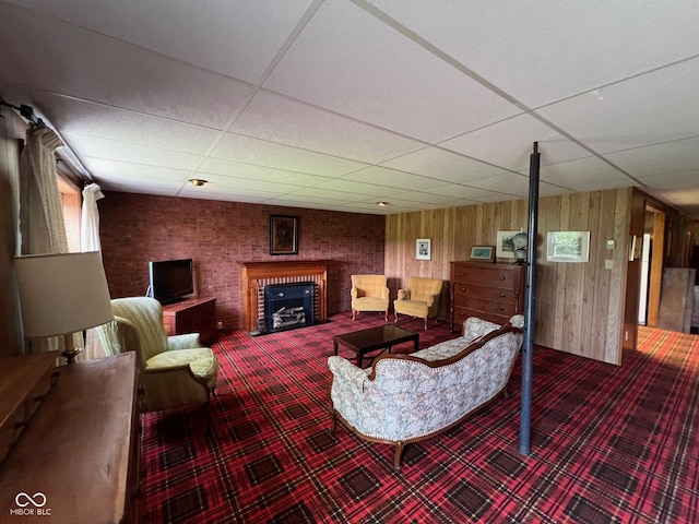 3654 W Mecca Rd, Rockville, IN 47872 - carpeted living room with a paneled ceiling, a fireplace, and wood walls