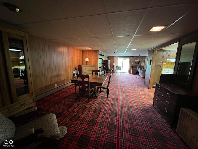 3654 W Mecca Rd, Rockville, IN 47872 - carpeted dining space featuring a baseboard heating unit, wood walls, and a drop ceiling