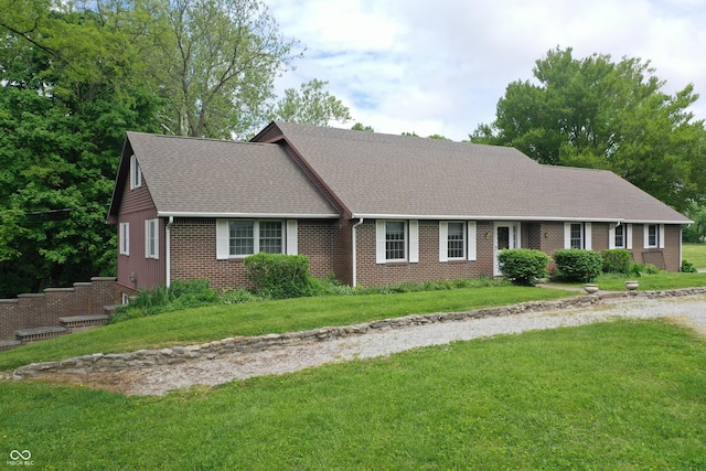 3654 W Mecca Rd, Rockville, IN 47872 - view of front facade featuring brick siding, a shingled roof, and a front lawn