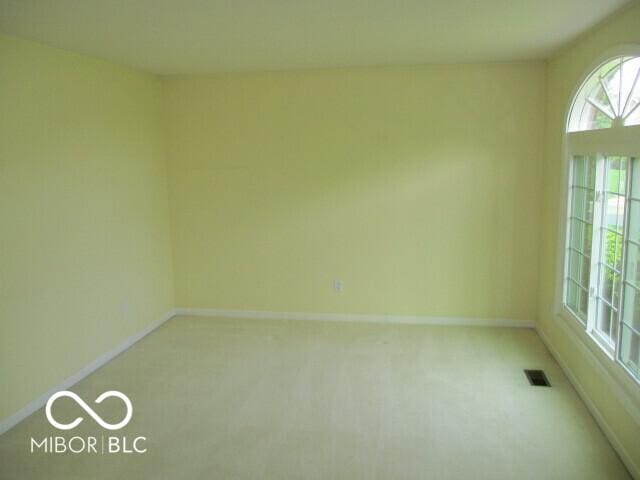 4667 Sundance Trl, Indianapolis, IN 46239 - spare room with light colored carpet and baseboards