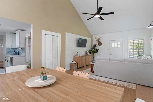1802 E 66th St, Indianapolis, IN 46220 - dining area featuring high vaulted ceiling, ceiling fan, and light wood-type flooring