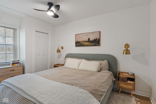 1802 E 66th St, Indianapolis, IN 46220 - bedroom featuring wood finished floors, baseboards, a closet, and a ceiling fan