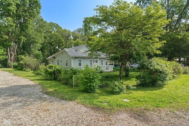 1802 E 66th St, Indianapolis, IN 46220 - view of property exterior featuring roof with shingles