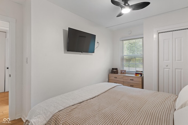 1802 E 66th St, Indianapolis, IN 46220 - bedroom featuring light wood-type flooring, a closet, and ceiling fan
