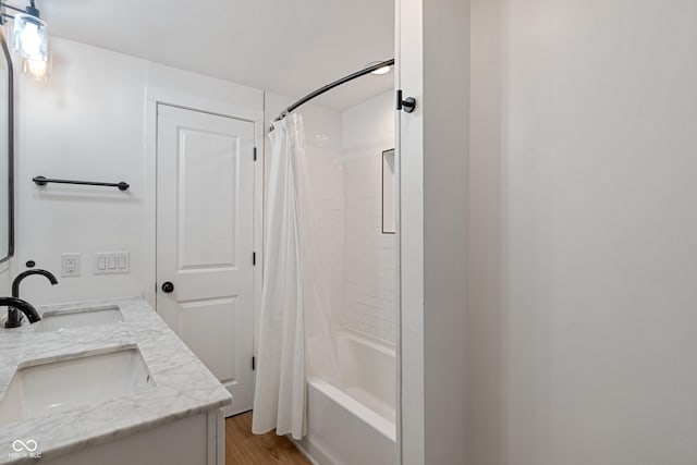 1802 E 66th St, Indianapolis, IN 46220 - full bath featuring double vanity, shower / bathtub combination with curtain, and wood finished floors