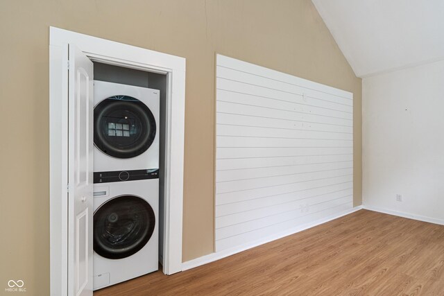 1802 E 66th St, Indianapolis, IN 46220 - washroom with estacked washer and dryer and wood finished floors