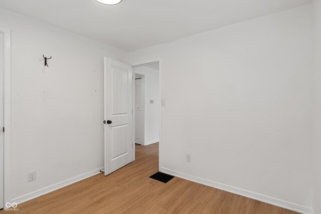 1802 E 66th St, Indianapolis, IN 46220 - empty room featuring baseboards and light wood-type flooring